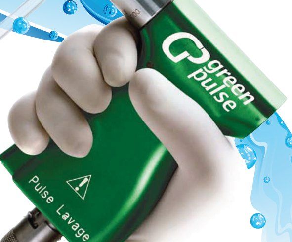 GreenPulse handpiece held in a gloved hand